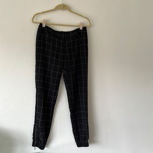 Black checked pants. With zipper detail at ankle